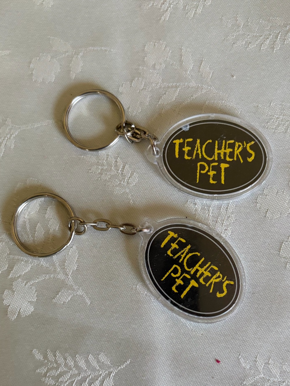TWO - Teacher's Pet & Angel Oval reversible Keychains